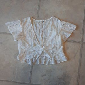 White lace crop top with ruffle detail, size XS